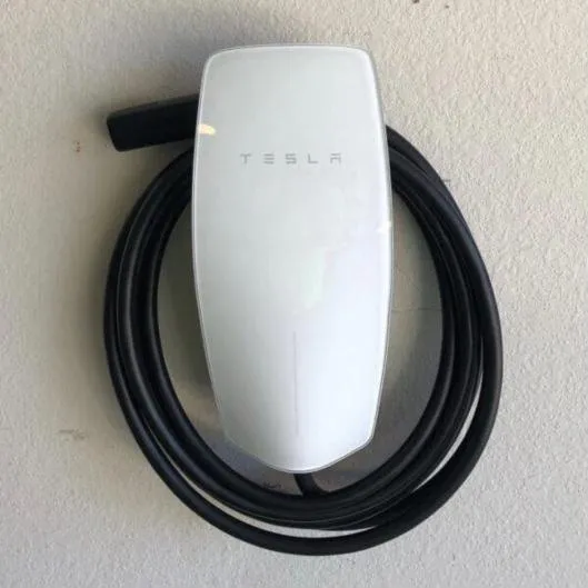Wall-mounted electric vehicle charger in a garage