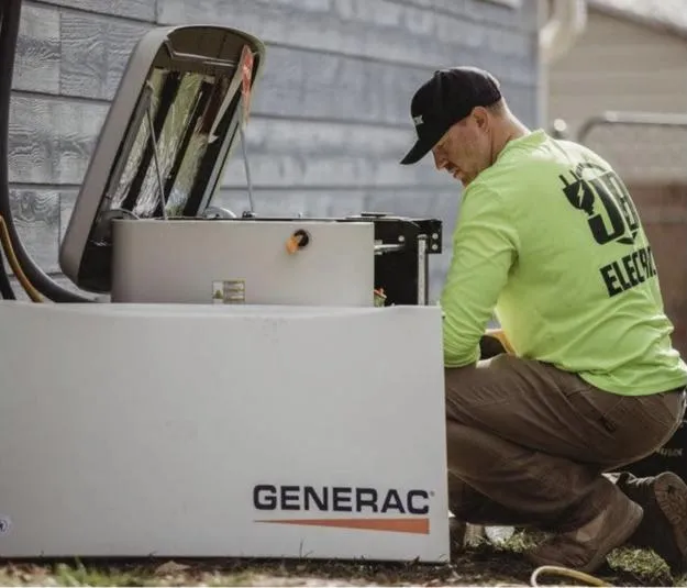 JB Electric electrician servicing a Generac standby generator